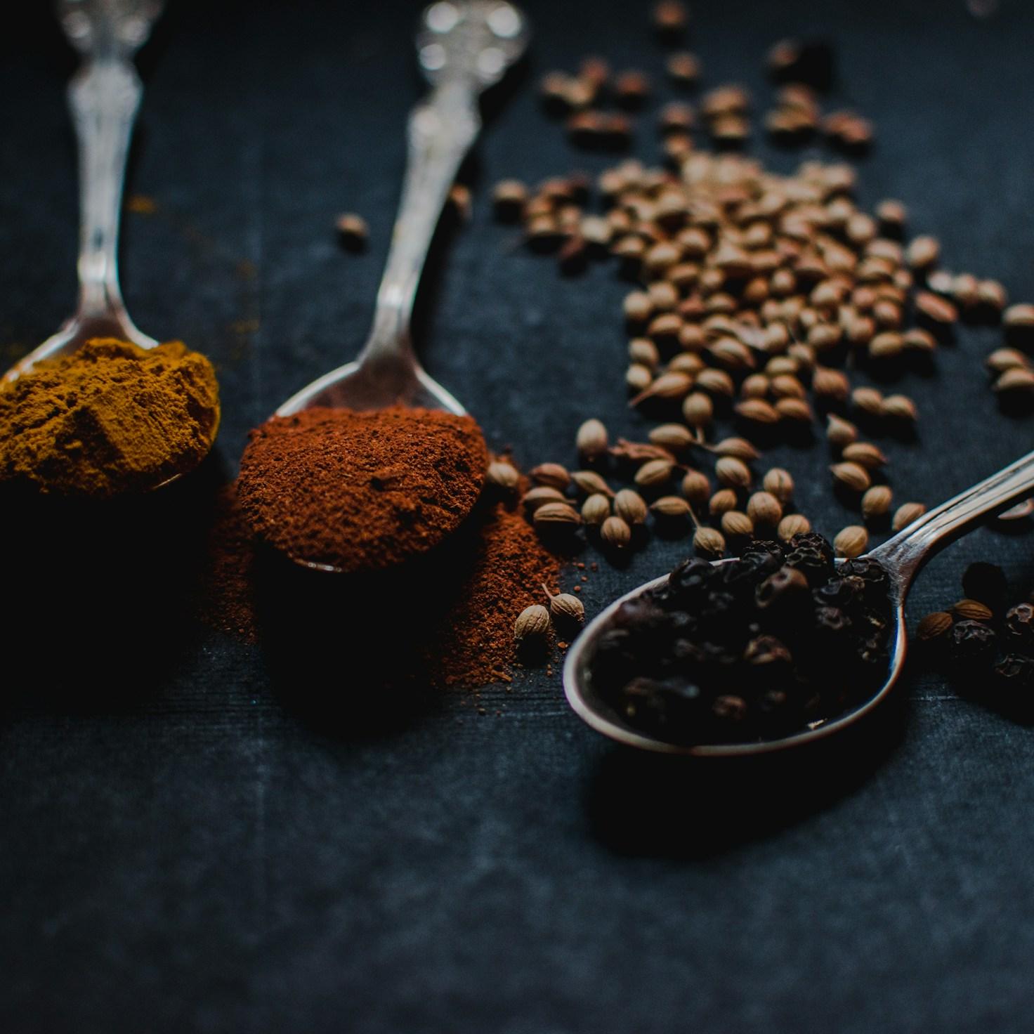 Members working together in a contemporary kitchen, exchanging recipes and techniques